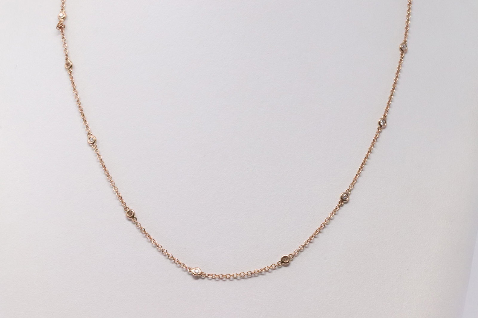 14Kt Rose Gold By The Yard Necklace.: Ladies 14Kt Rose Gold By The Yard Necklace. Necklace has 12 Diamonds side to side. Necklace length: 17.00" Total weight: 2.78 Grams. Necklace adjustable.
