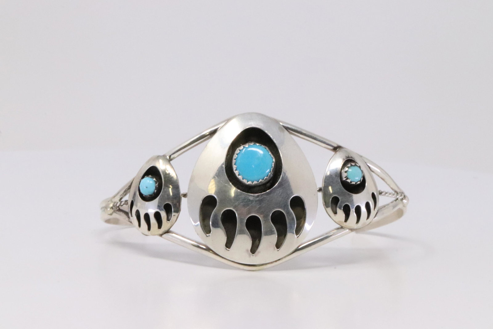 Native America Navajo Handmade Sterling Silver Paw Bear: This is a Native America Navajo Handmade Sterling Silver Paw Bear Turquoise Bracelet By Janice Spencer.