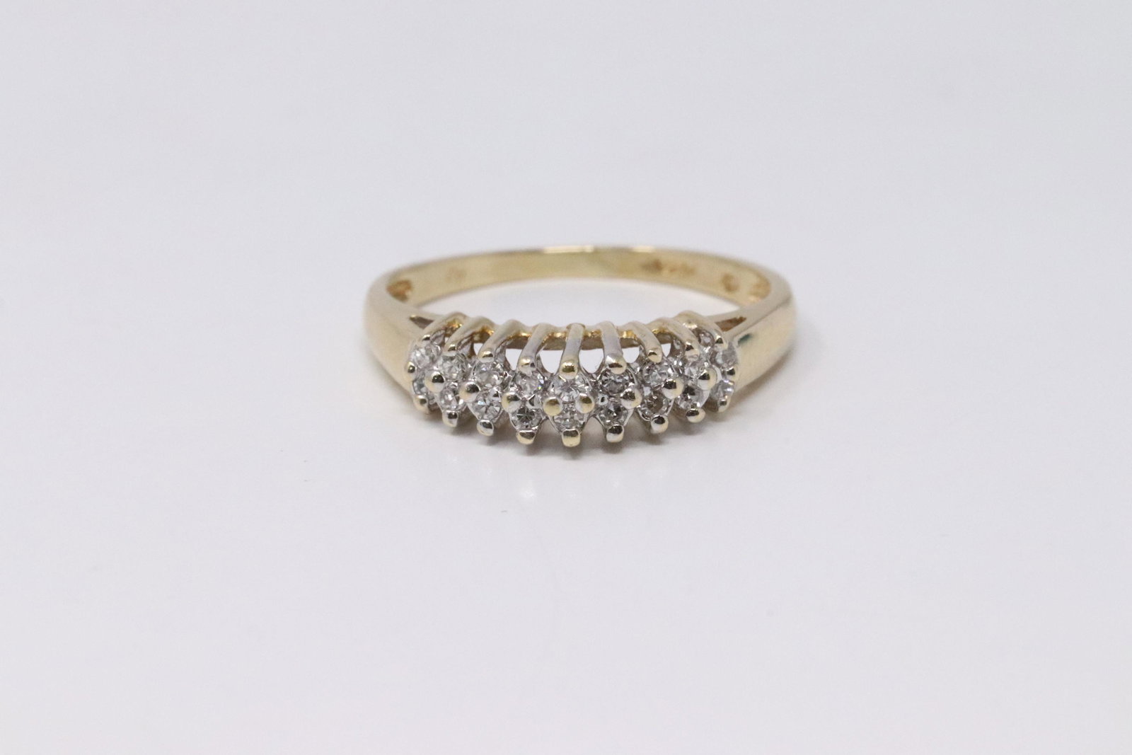 14KT Lady's Yellow Diamond Gold.: 14kt Lady's Yellow Gold Diamond Ring. Ring has in total 18 round diamonds. Ring Size: 5.75. Total weight: 2.58 Grams.