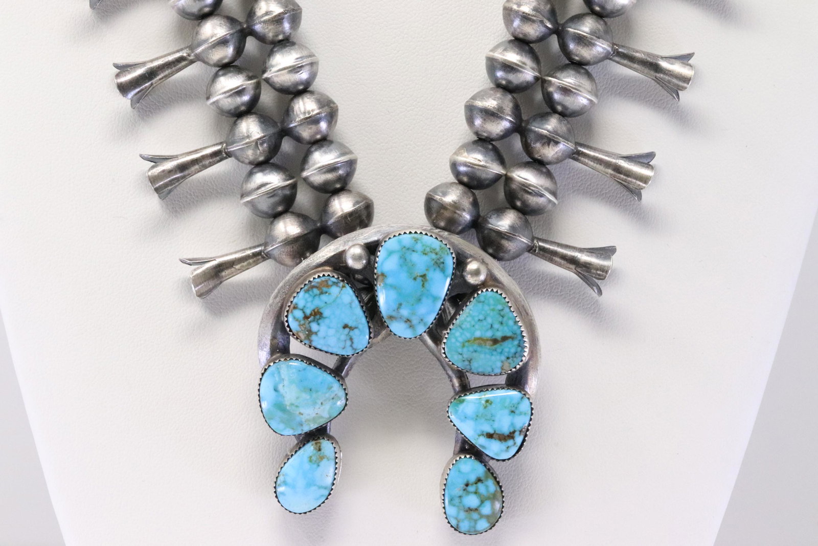 Native American Navajo Handmade Sterling Silver Naja Kingman Turquoise Squash Blossom Necklace &: This is a Native American Navajo Handmade Sterling Silver Naja Kingman Turquoise Squash Blossom Necklace & Earring's Set By Gilbert Martin. Necklace length: 24.00"