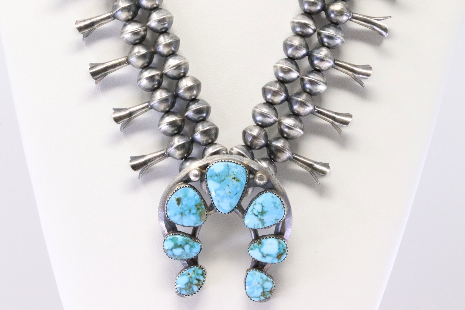 Native America Navajo Handmade Sterling Silver Naja Kingman Turquoise Squash Blossom Necklace &: This is a Native America Navajo Handmade Sterling Silver Naja Kingman Turquoise Squash Blossom Necklace & Earring's Set By Gilbert Martin. Necklace length: 24.00"