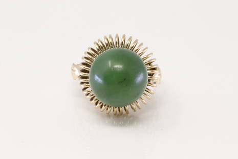 14Kt Yellow Gold Jade Ring.: Ladies 14Kt Yellow Gold Jade Ring. Ring has 1 Jade Stone on the center. Ring size: 6.75. Total weight: 7.91 Grams.