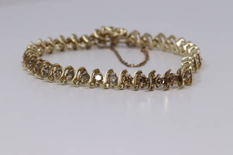 14Kt Ladies Diamond Bracelet ( 3.50ctw): A ladies 14kt Yellow Gold Diamond Tennis Bracelet. The bracelet has a total of 36 round brilliant diamonds. The diamonds weight approx 3.75tcw. The diamonds color are Chocolate diamonds. Diamond