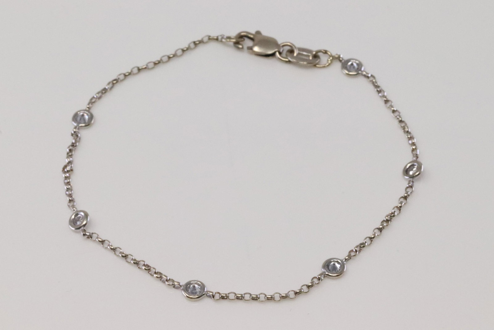 14Kt White Gold Diamond By The Yard Bracelet.: Ladies 14Kt White Gold Diamond By The Yard Bracelet. Bracelet has 6 Diamonds side to side. Bracelet length: 7.00". Diamonds weight approx 0.35cttw.