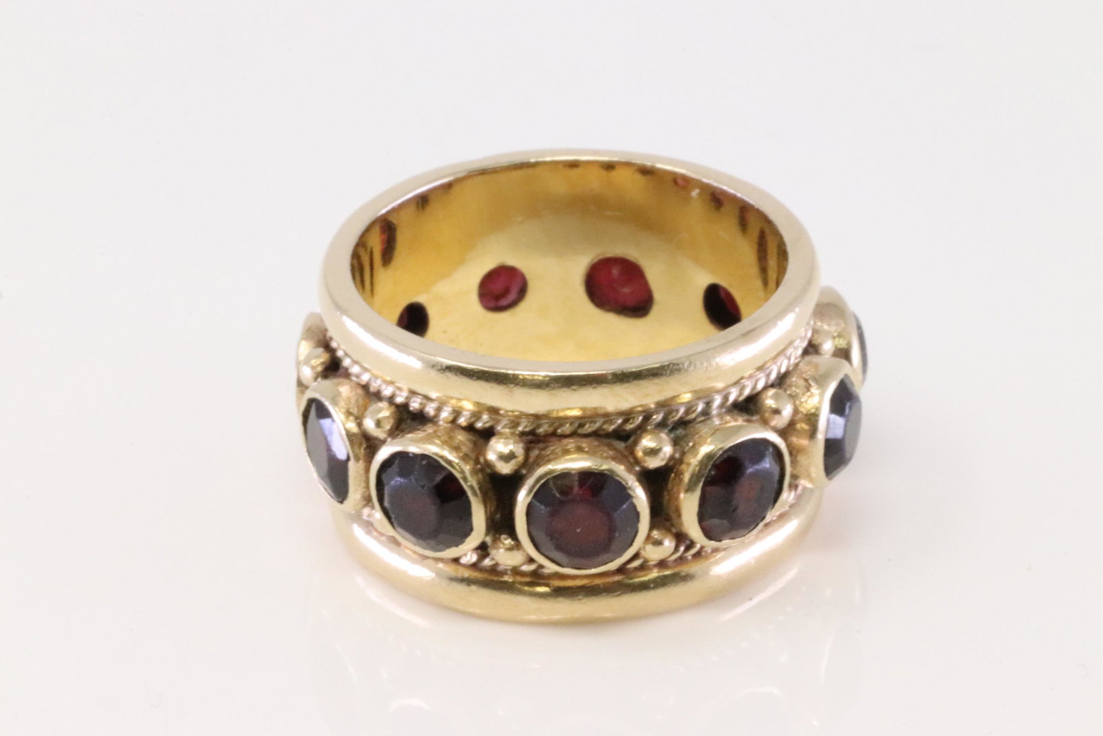 14Kt Yellow Gold Vintage Garnet Eternity Ring.: Ladies 14Kt Yellow Gold Vintage Garnet Eternity Ring. Ring has 11 round Garnet. Ring size: 6.50. Total weight: 10.40 Grams.