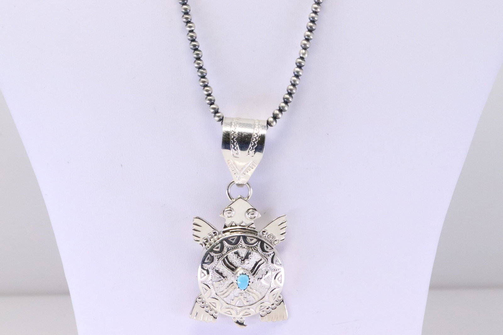 Native America Navajo Handmade Sterling Silver Turquoise Turtle Pendant & Pearl Beaded Necklace By: This is a Native America Navajo Handmade Sterling Silver Turquoise Turtle Pendant & Pearl Beaded Necklace By Alonzo Mariano. Necklace length: 18.00"