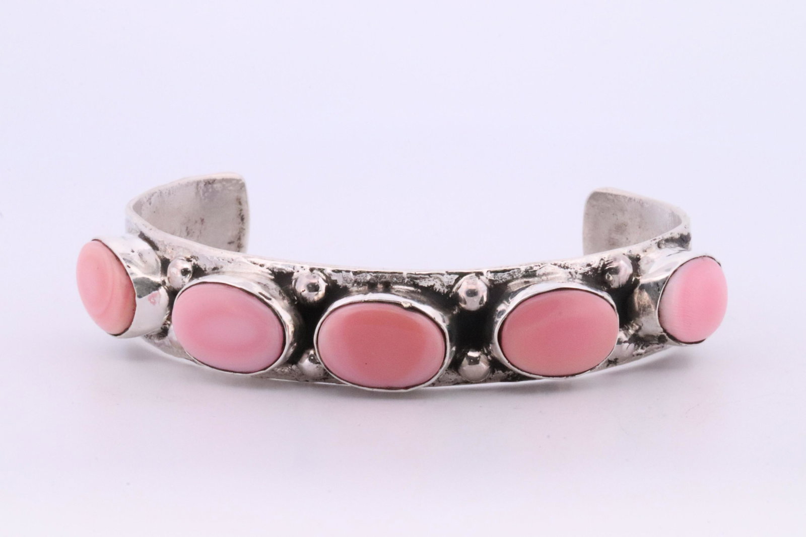 Native America Zuni Handmade Sterling Silver Pink Shell Concho Bracelet By Jude Candelaria.: This is a Native America Zuni Handmade Sterling Silver Pink Shell Concho Bracelet By Jude Candelaria.