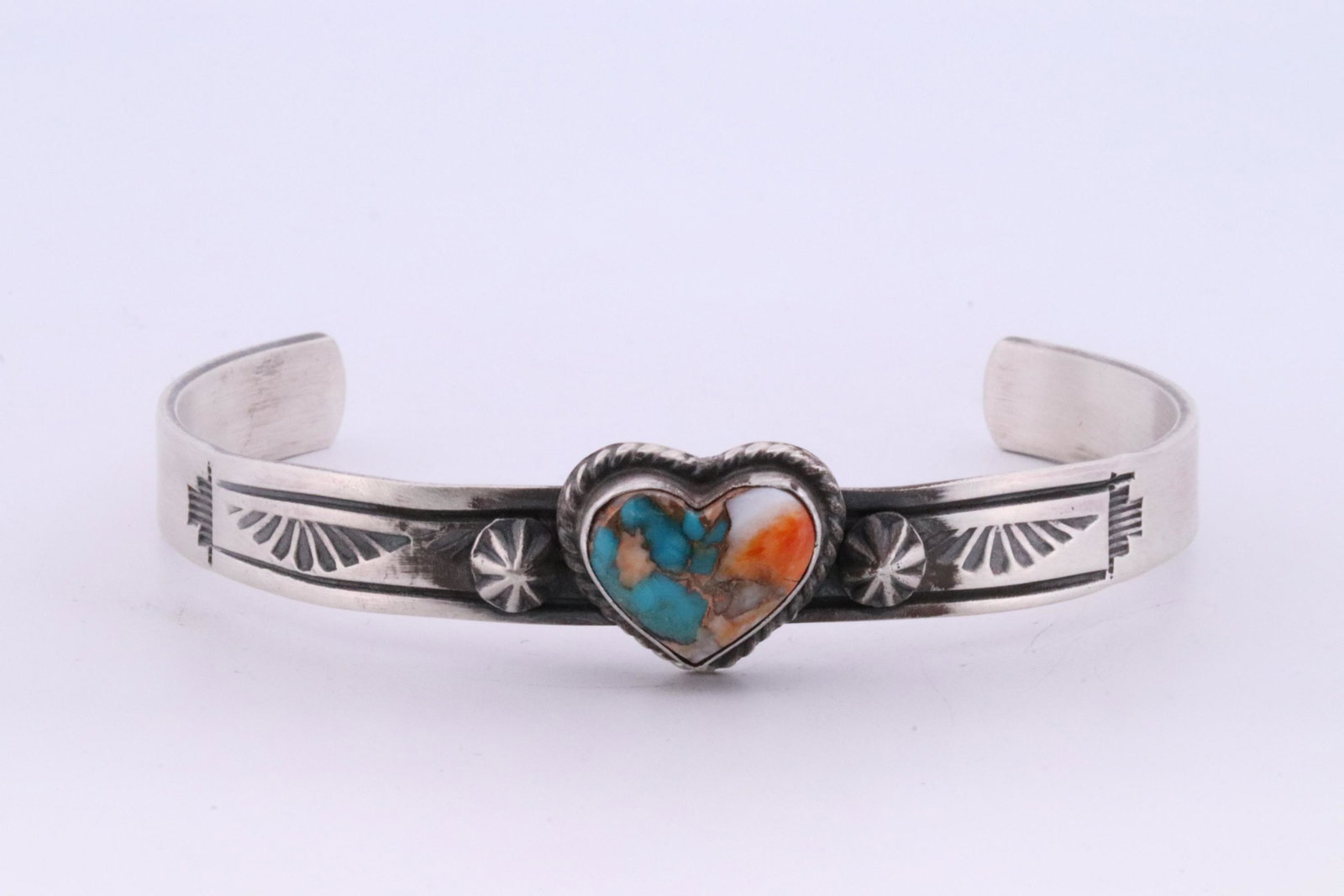 Native American Navajo Handmade Sterling Silver Compressed Turquoise Heart By Rick Enriquez.: This is a Native American Navajo Handmade Sterling Silver Compressed Turquoise Heart By Rick Enriquez.