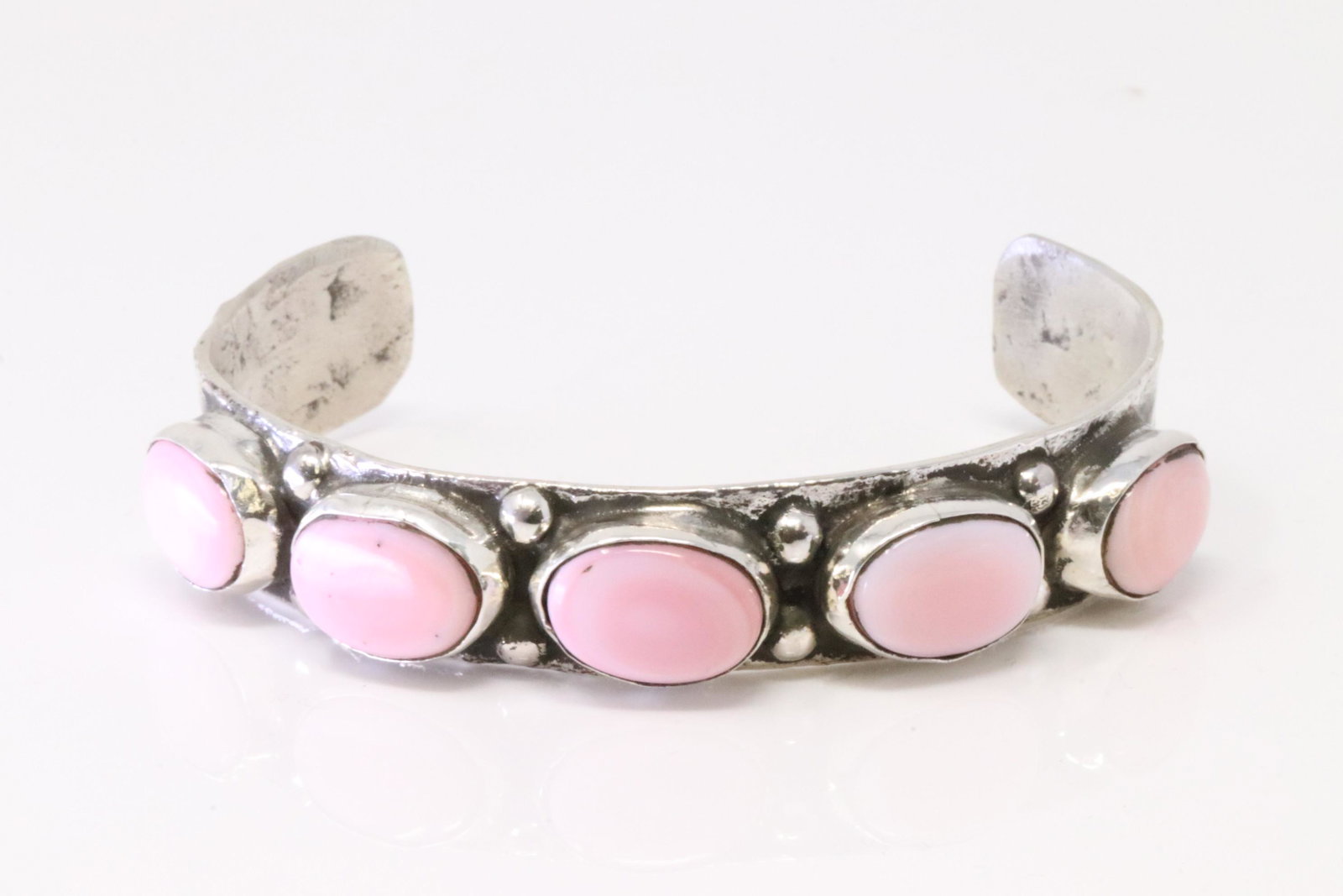 Native America Zuni Handmade Sterling Silver Pink Shell Concho Bracelet By Jude Candelaria.: This is a Native America Zuni Handmade Sterling Silver Pink Shell Concho Bracelet By Jude Candelaria.