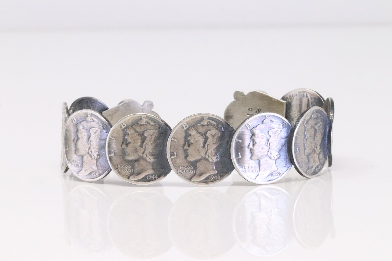 Native America Navajo Handmade Sterling Silver Turquoise Liberty Dime Bracelet By James McCabe.: This is a ive America Navajo Handmade Sterling Silver Turquoise Liberty Dime Bracelet By James McCabe.