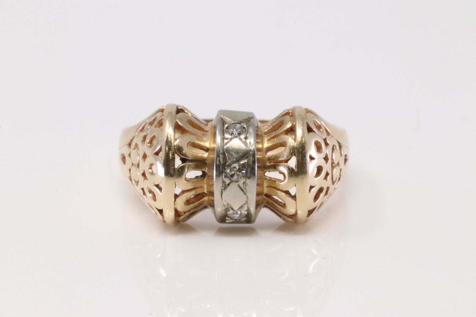 Vintage 14Kt Yellow & White Gold Diamond Ring.: Ladies Vintage 14Kt Yellow & White Gold Diamond Ring. Ring has 3 Diamonds on the center. Ring size: 7.25. Total weight: 4.96 Grams.