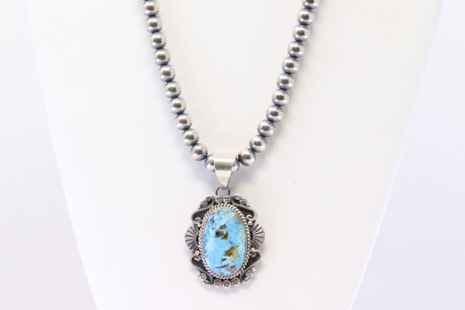 Native America Navajo Sterling Silver Turquoise Pendant. With Pearl Beaded Sterling Silver Machine: This is a Native America Navajo Sterling Silver Turquoise Pendant. With Pear Beaded Sterling Silver Machine Made Necklace By M.Spencer. Necklace length: 22.00"