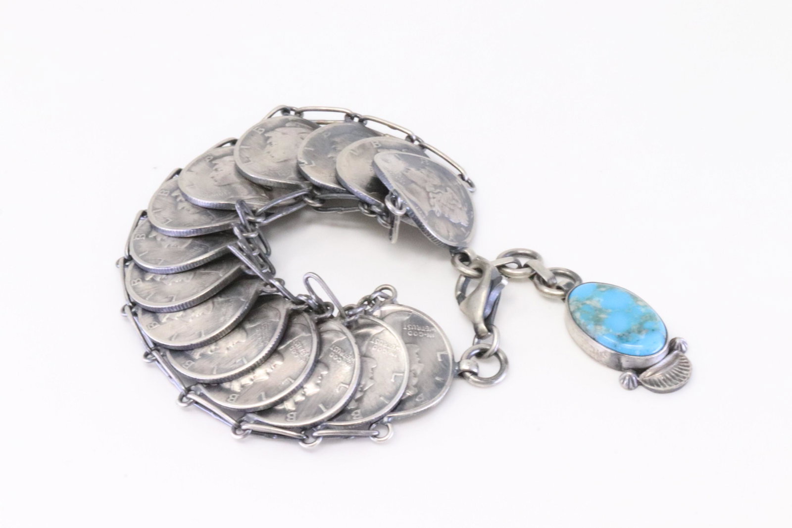 Native America Navajo Sterling Silver Turquoise Liberty Dime Bracelet Link By James McCabe.: This is a Native America Navajo Sterling Silver Turquoise Liberty Dime Bracelet Link By James McCabe. Bracelet length: 5.50" Adjustable.
