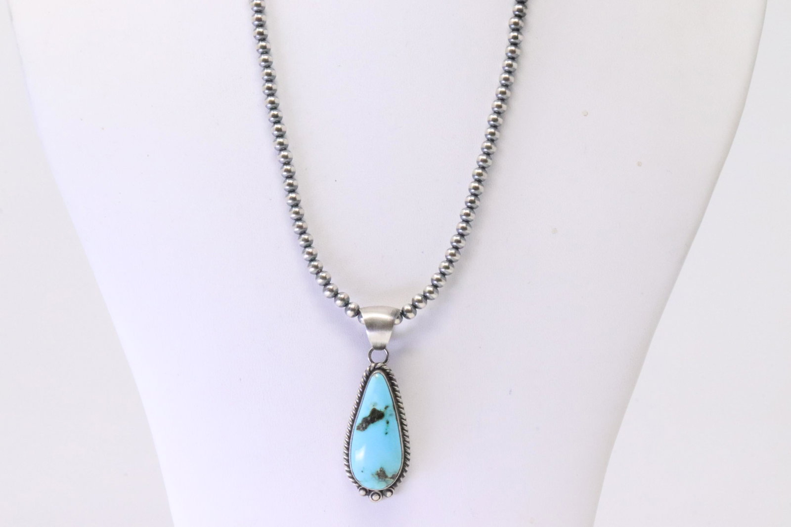 Native America Navajo Sterling Silver Kingman Turquoise Pendant By Alfred Martinez. With Pearl: This is a Native America Navajo Sterling Silver Kingman Turquoise Pendant By Alfred Martinez. With Pearl Beaded Sterling Silver Machine Made Necklace. Necklace length: 16.00"