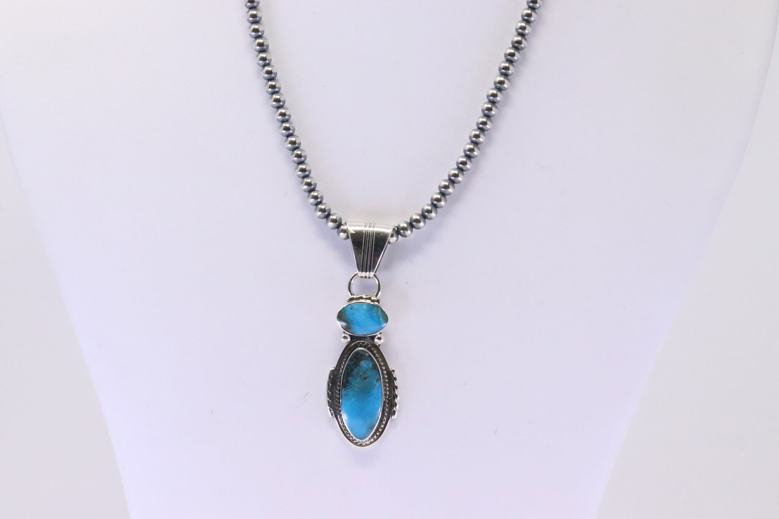 Native America Navajo Sterling Silver Turquoise Pendant By Sadie Jim. With Pearl Beaded Sterling: This is a Native America Navajo Sterling Silver Turquoise Pendant By Sadie Jim. With Pearl Beaded Sterling Silver Machine Made Necklace. Necklace length: 16.00"