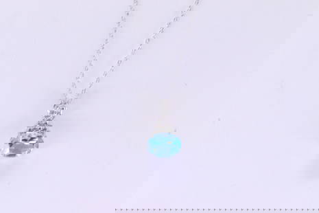 Blue Topaz & Diamond Pendant / Necklace 10Kt.: Ladies 10Kt White Gold Blue Topaz & Diamond Pendant / Necklace. Pendant has one Blue Topaz Gesmtone with 12 round Diamonds & A 10k necklace. Diamonds weight: 0.06 cttw. Necklace length: 18.00"