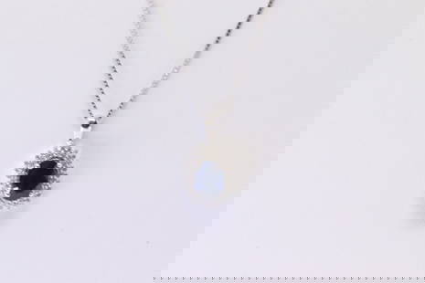 Sapphire & Diamond Pendant / Necklace: Ladies 10Kt White Gold Sapphire & Diamond Pendant / Necklace. Pendant has one Oval Sapphire with approx 50 round accent Diamonds & A Necklace. Diamonds weight: 0.18 cttw. Necklace length: 18.00"