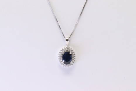 Sapphire & Diamond Pendant / Necklace: Ladies 10Kt White Gold Sapphire & Diamond Pendant / Necklace. Pendant has one Oval Sapphire with approx 50 round accent Diamonds & A Necklace. Diamonds weight: 0.18 cttw. Necklace length: 18.00"