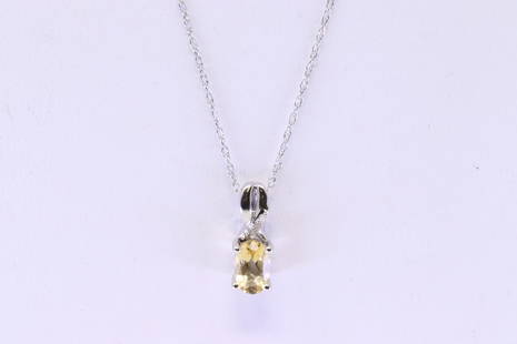 Citrine & Diamond Pendant / Necklace 10Kt.: Ladies 10Kt White Gold Citrine & Diamond Pendant / Necklace. Pendant has one Oval Citrine Gemstone with 3 accent Diamonds & A 14K Necklace. Necklace length: 18.00"