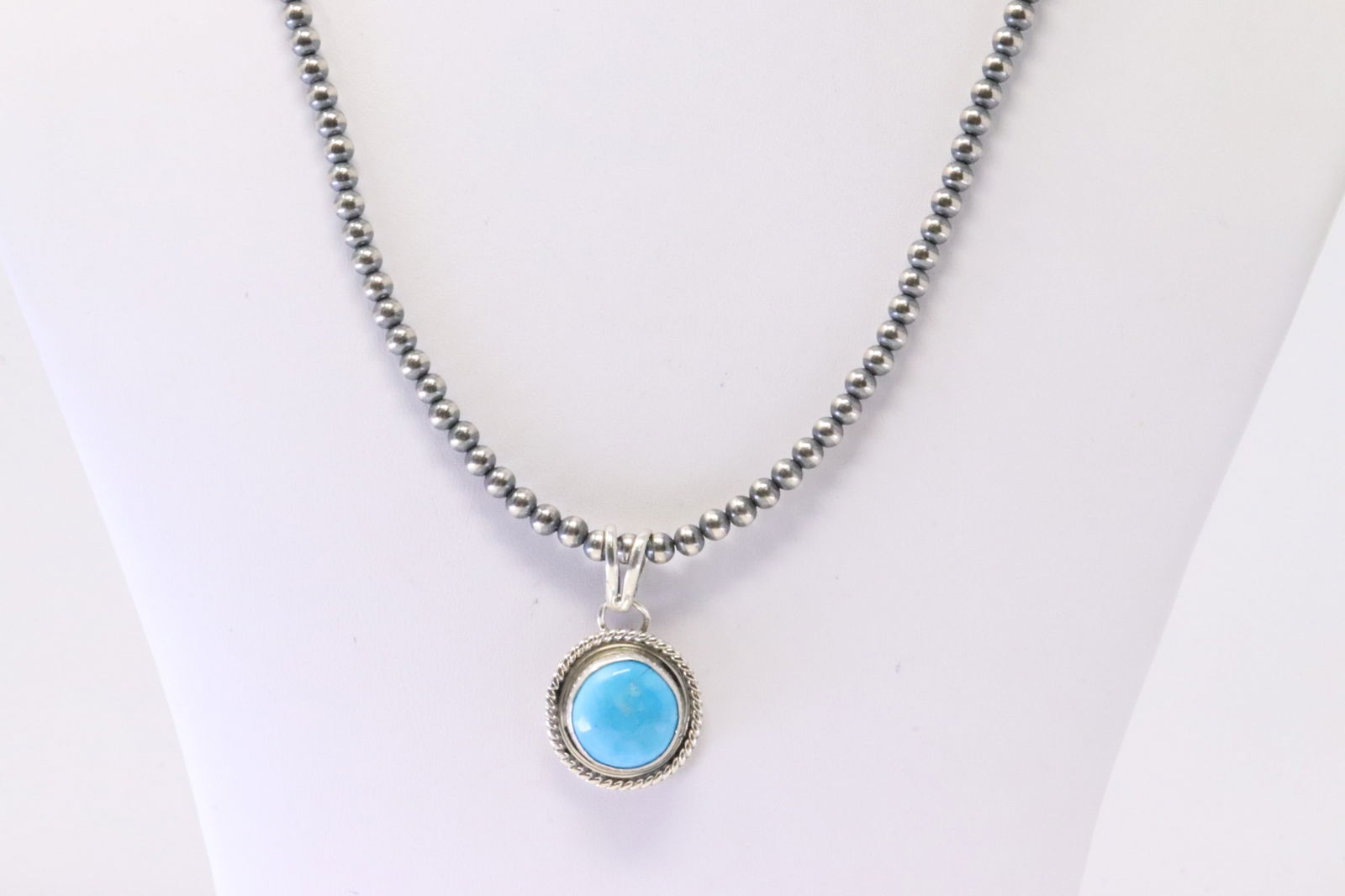 Native America Navajo Sterling Silver Turquoise Pendant By Yazzie. With Pear Beaded Sterling Silver: This is a Native America Navajo Sterling Silver Turquoise Pendant By Yazzie. With Pear Beaded Sterling Silver Machine Made Necklace. Necklace length: 22.00"