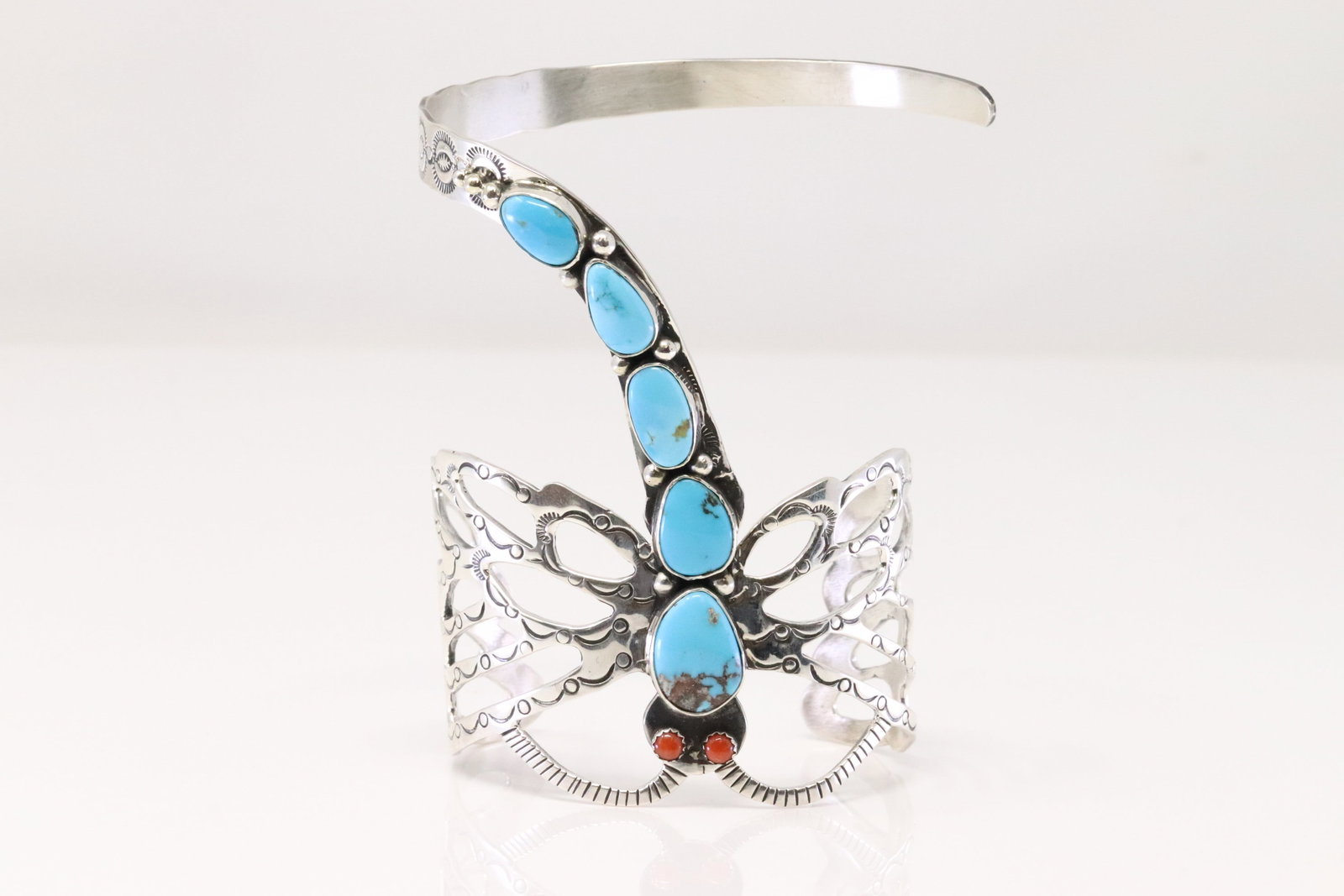 Native American Navajo Sterling Silver Coral & Turquoise Dragonfly Bracelet By Russell Sam.: This is a Native American Navajo Sterling Silver Coral & Turquoise Dragonfly Bracelet By Russell Sam. Total weight: 77.50 Grams.