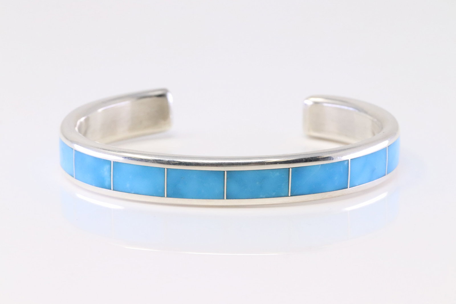 Native America Zuni Sterling Silver Kingman Turquoise Inlay Bracelet By Larry Loretta.: This is a Native America Zuni Sterling Silver Kingman Turquoise Inlay Bracelet By Larry Loretta.