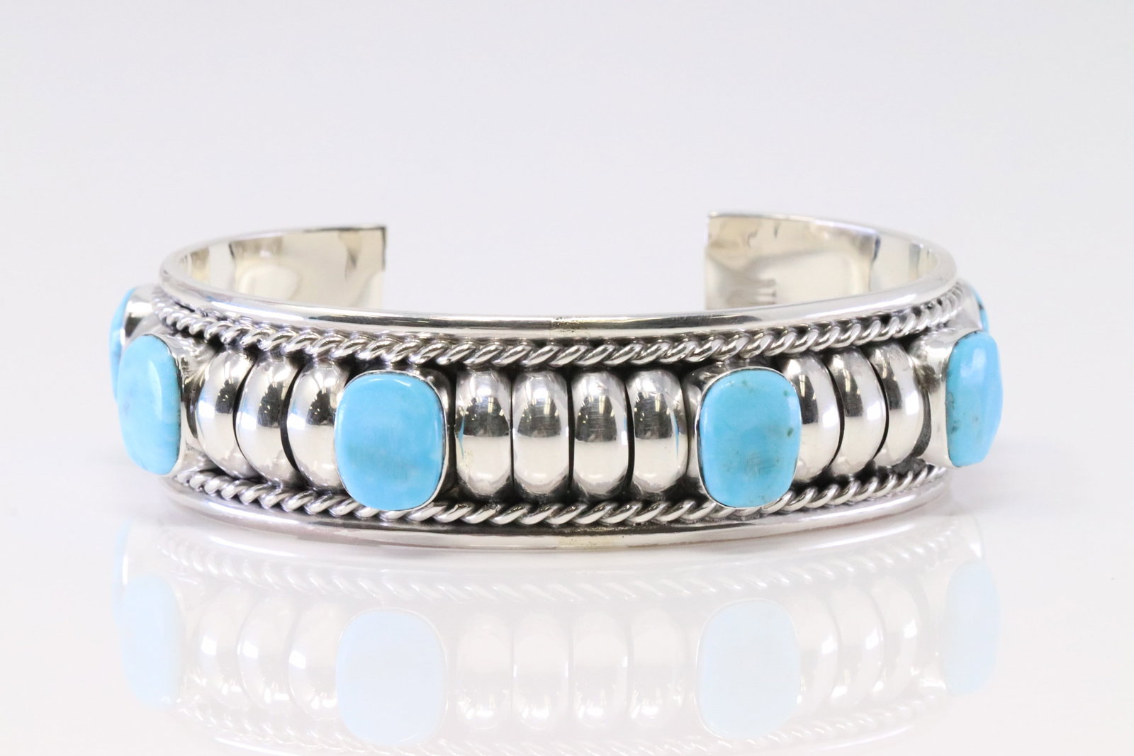 Native America Navajo Sterling Silver Turquoise Bracelet Cuff By Manuel Johnson.: This is a Native America Navajo Sterling Silver Turquoise Bracelet Cuff By Manuel Johnson.