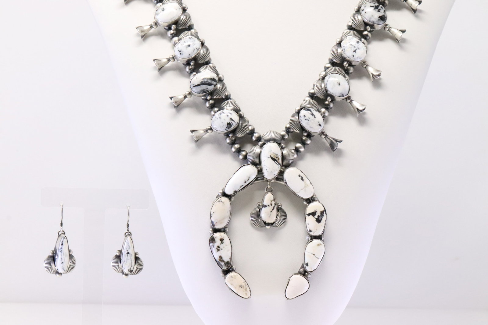 Native America Navajo Sterling Silver White Buffalo Squash Blossom Necklace & Earring's Set By: This is a Native America Navajo Sterling Silver White Buffalo Squash Blossom Necklace & Earring's Set By Kee.J. Necklace length: 180. Grams.