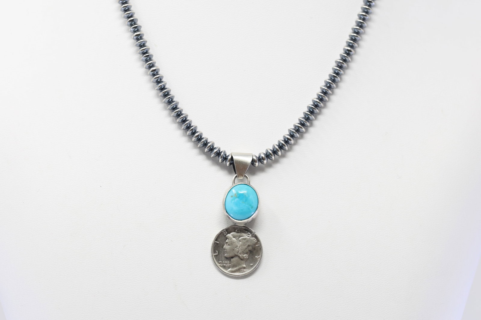 Native America Navajo Sterling Silver Turquoise Dime Pendant By F. With Pearl Beaded Sterling Silver: This is a Native America Navajo Sterling Silver Turquoise Dime Pendant By F. With Pearl Beaded Sterling Silver Machine Made Necklace. Necklace length: 18.00"