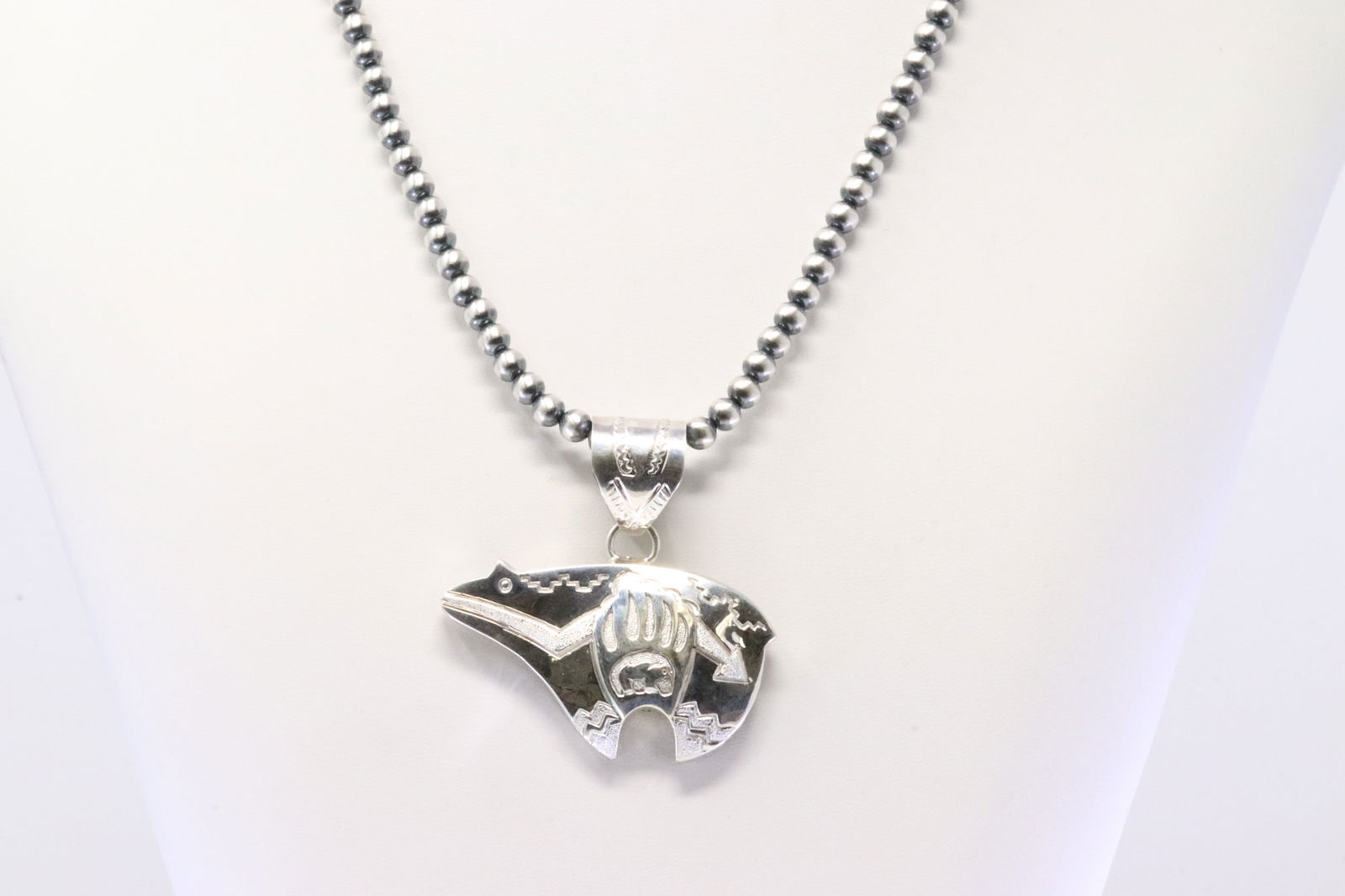 Native America Navajo Sterling Silver Bear Pendant By A.Mariano. With Pearl Beaded Sterling Silver: This is a Native America Navajo Sterling Silver Bear Pendant By A.Mariano. With Pearl Beaded Sterling Silver Machine Made. Necklace length: 20.00"