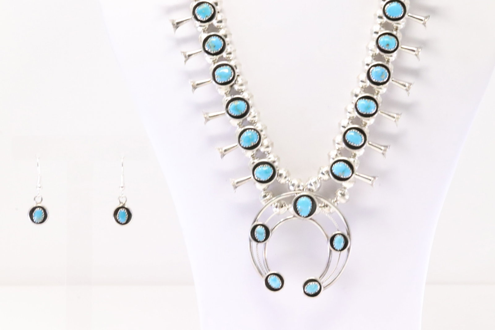 Native America Navajo Sterling Silver Turquoise Baby Squash Blossom Necklace & Earring's Set By: This is a Native America Navajo Sterling Silver Turquoise Baby Squash Blossom Necklace & Earring's Set By P.G. Necklace length: 20.00"