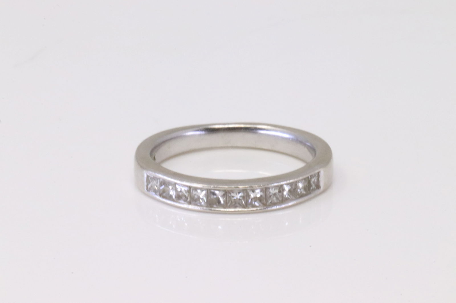 Classic White Diamond Ring 14kt.: 14KT White Gold Classic Diamond Ring. The Ring has Classic Band with 11 Round Diamonds. Diamond wieght approx: 0.75ctw. Ring size:6.75. Total weight 3.40 Grams.
