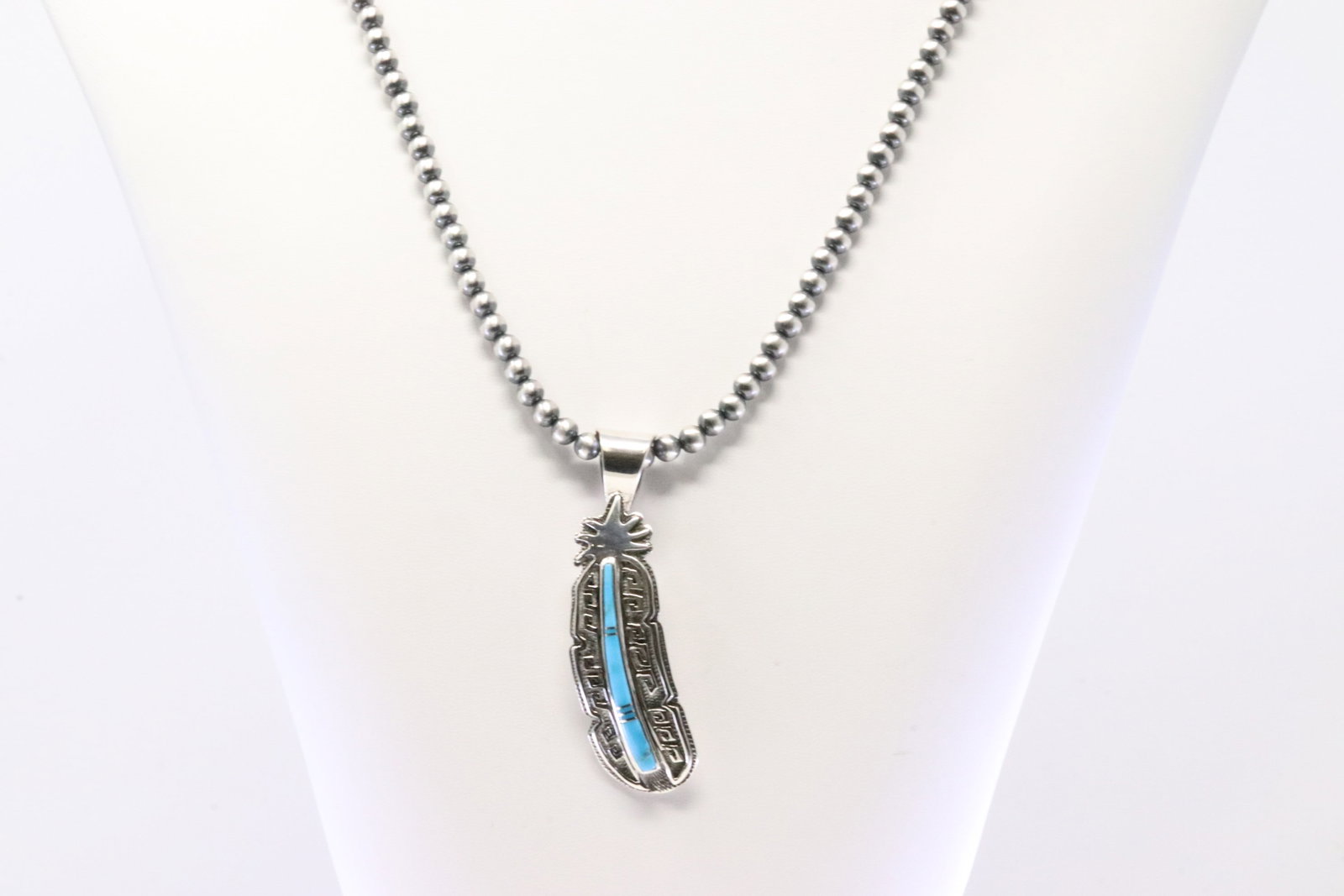Native America Navajo Sterling Silver Turquoise Pendant By Rick T. With Pearl Beaded Sterling Silver: This is a Native America Navajo Sterling Silver Turquoise Pendant By Rick T. With Pearl Beaded Sterling Silver Machine Made Necklace. Necklace length: 24.00"