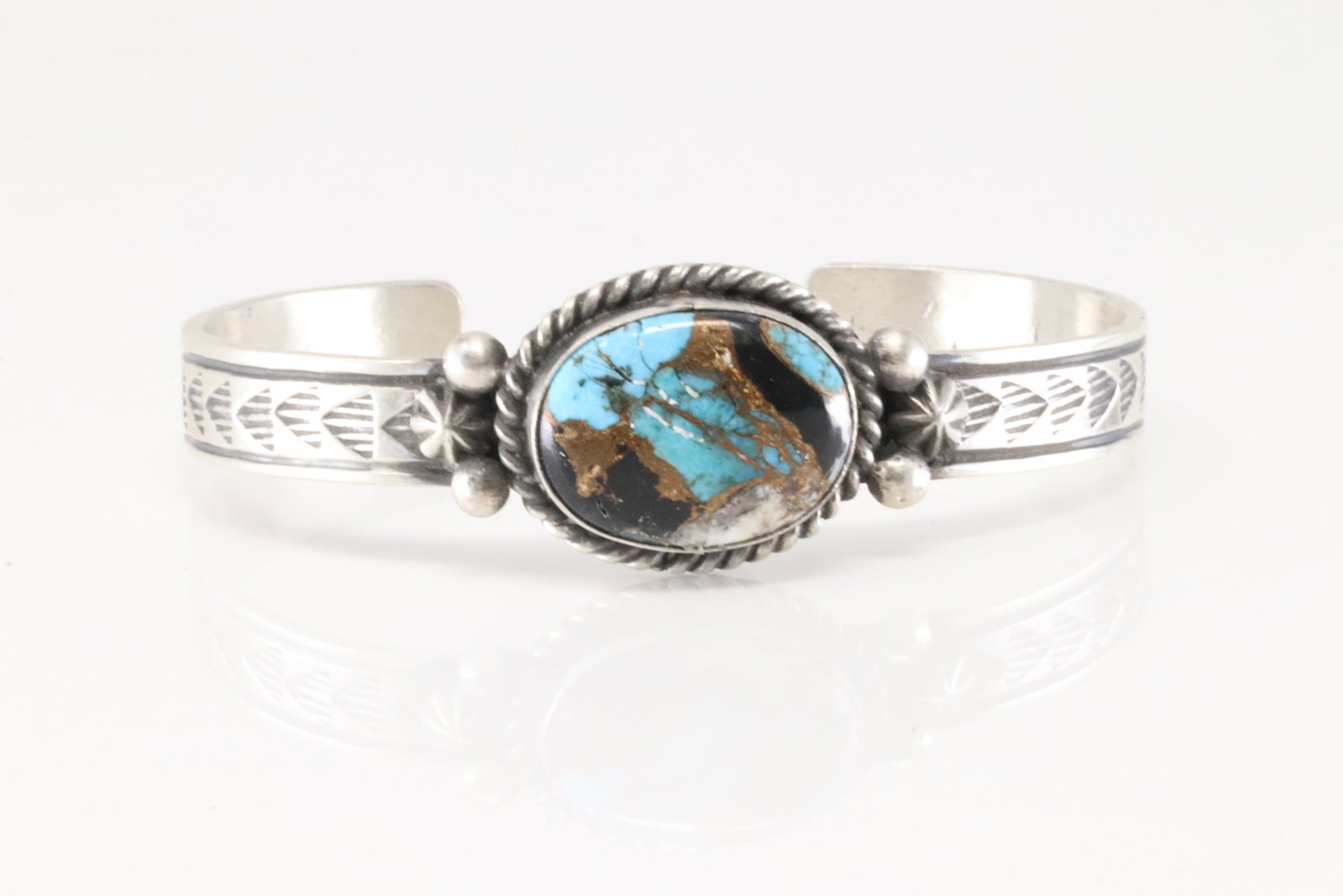 Native American Navajo Sterling Silver Turquoise Compressed Barcelet By Rick Enriquez.: This is a Native American Navajo Sterling Silver Turquoise Compressed Barcelet By Rick Enriquez.