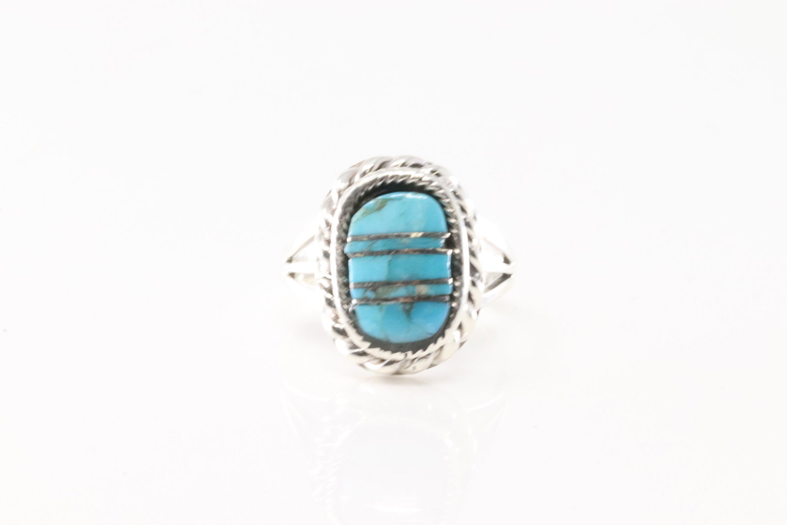 Native America Navajo Sterling Silver Turquoise Inlay Ring By James Manygoats.: This is a Native America Navajo Sterling Silver Turquoise Inlay Ring By James Manygoats. Ring size: 7.00.