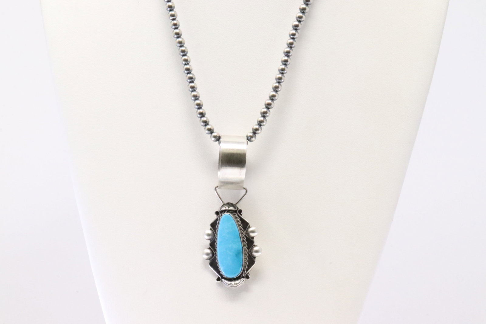 Native America Navajo Sterling Silver Turquoise Pendant By Wilson Dawes. With Pearl Beaded Sterling: This is a Native America Navajo Sterling Silver Turquoise Pendant By Wilson Dawes. With Pearl Beaded Sterling Silver Machine Made Necklace. Necklace length: 20.00"
