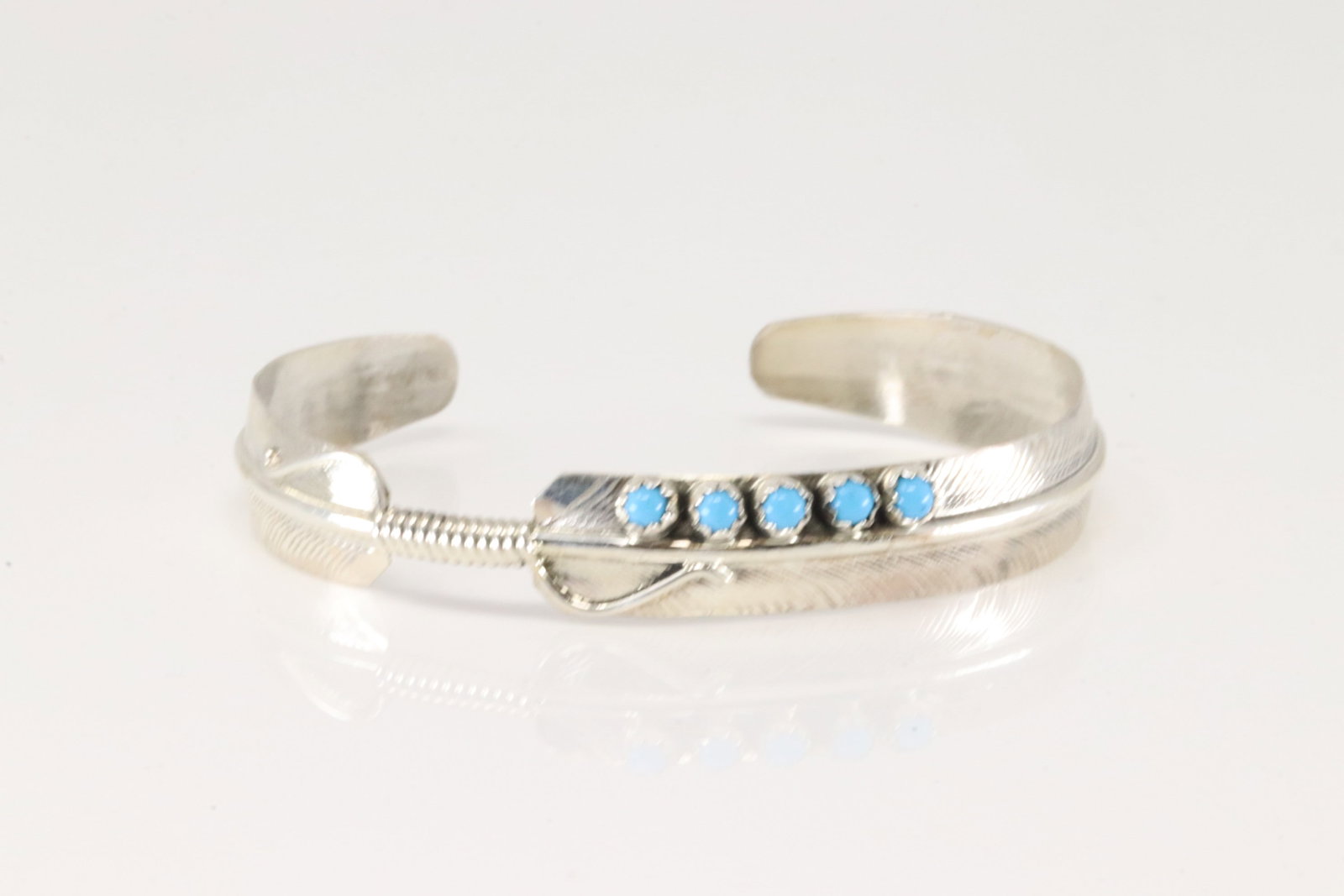 Native America Navajo Sterling Silver Turquoise Feather Bracelet Cuff By Chester Charley.: This is a Native America Navajo Sterling Silver Turquoise Feather Bracelet Cuff By Chester Charley.