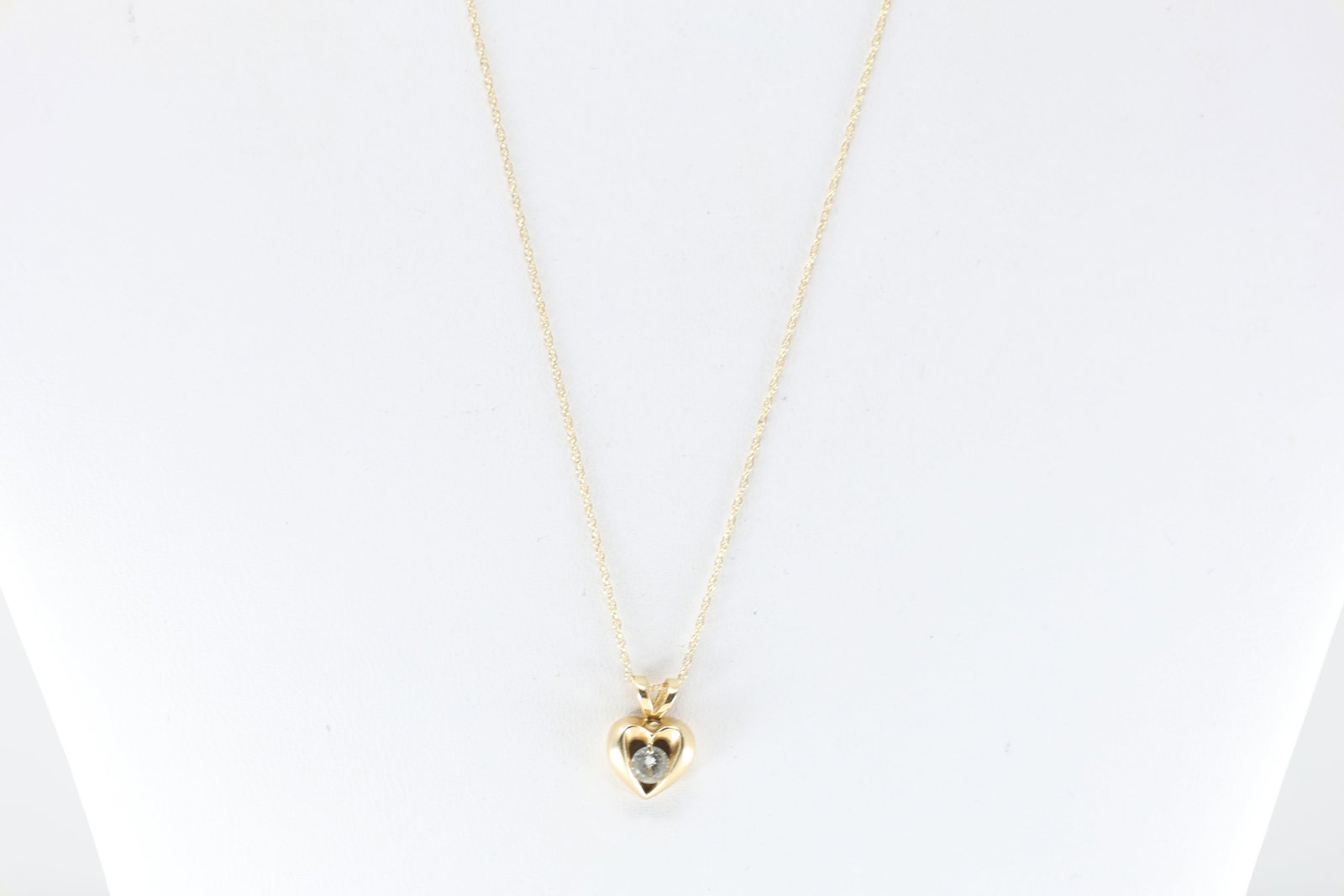 Diamond Heart Pendant / Necklace 14Kt.: 14Kt Yellow Gold Diamond Heart Pendant / Necklace. This 14K chain has a heart pendant with one brilliant diamond in the center. Diamond weight approx: 0.20ct.Necklace length: 18.00"