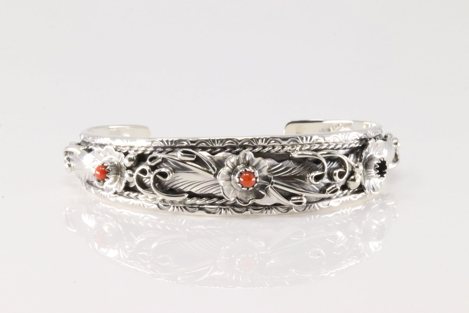 Native America Navajo Sterling Silver Coral Bracelet Cuff By Bessie Joe.: This is a Native America Navajo Sterling Silver Coral Bracelet Cuff By Bessie Joe.