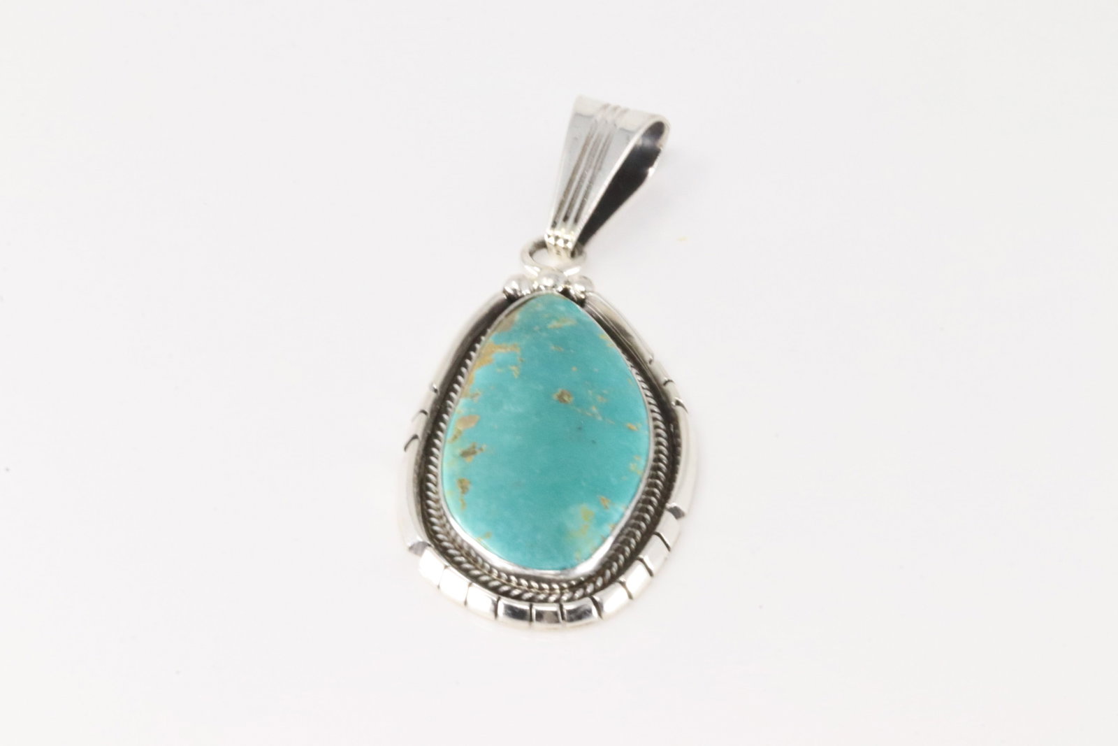 Native America Navajo Sterling Silver TurquoisePendant By Samuel Yellowhair.: This is a Native America Navajo Sterling Silver Turquoise Pendant By Samuel Yellowhair.