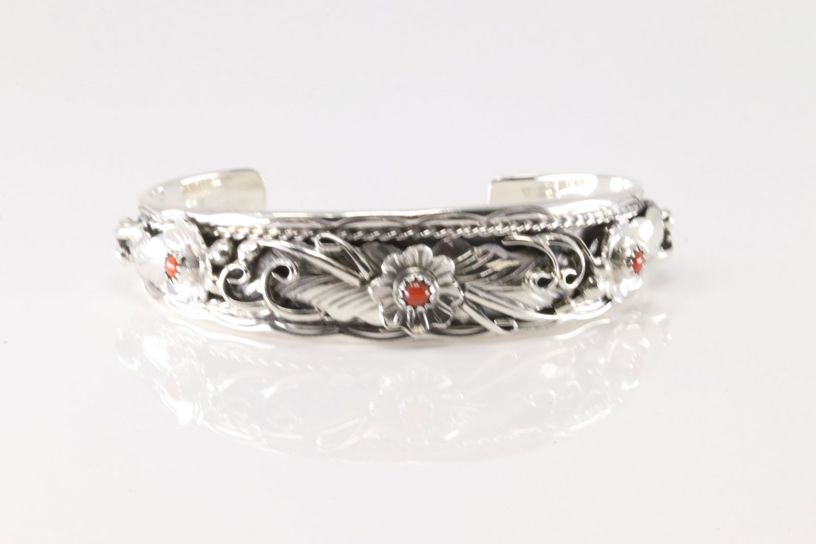 Native America Navajo Sterling Silver Coral Floral Bracelet Cuff By Bessie Joe.: This is a Native America Navajo Sterling Silver Coral Floral Bracelet Cuff By Bessie Joe.