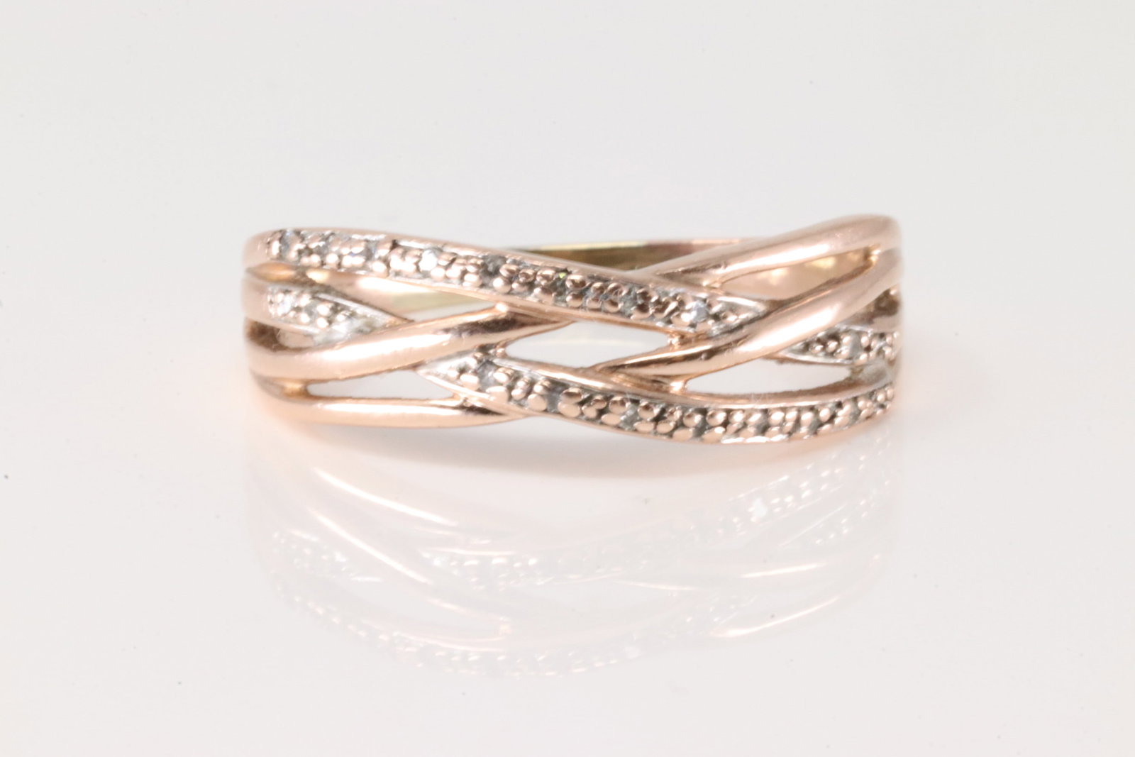 Diamond Ring 10Kt.: Ladies 10Kt Rose Gold Diamond Ring. This ring has 20 round diamonds. Ring size: 9.50. Total weight: 2.90 Grams.