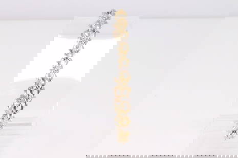 14Kt Yellow Gold Diamond Bracelet.: Ladies 14Kt Yellow Gold Diamond Bracelet. Bracelet has 50 Diamonds side to side. Bracelet length: 7.5" Total weight: 12.23 Grams.