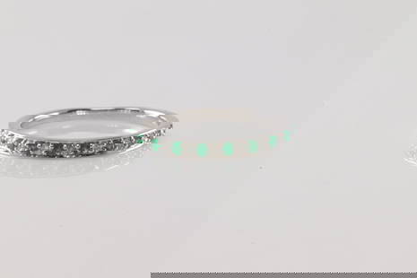 Emerald & Diamond Ring 14Kt.: Ladies 14Kt White Gold Emerald & Diamond Ring. This Ring has 10 Green emeralds with 9 round Diamonds. Diamonds weight: 0.09ctw. Emeralds weight: 0.10ctw. Ring size: 6.25.