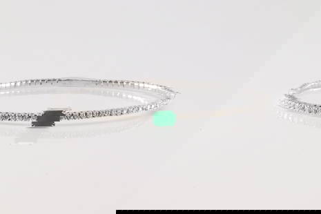 Emerald & Diamond Bangle Bracelet 14Kt.: 14Kt White Gold Emerald & Diamond Bangle Bracelet. This Elegant Bangle Bracelet has Green Emerald Surrender By 48 Brilliants Diamonds. Diamonds weight: 0.85ctw. Total weight: 6.50 Grams.