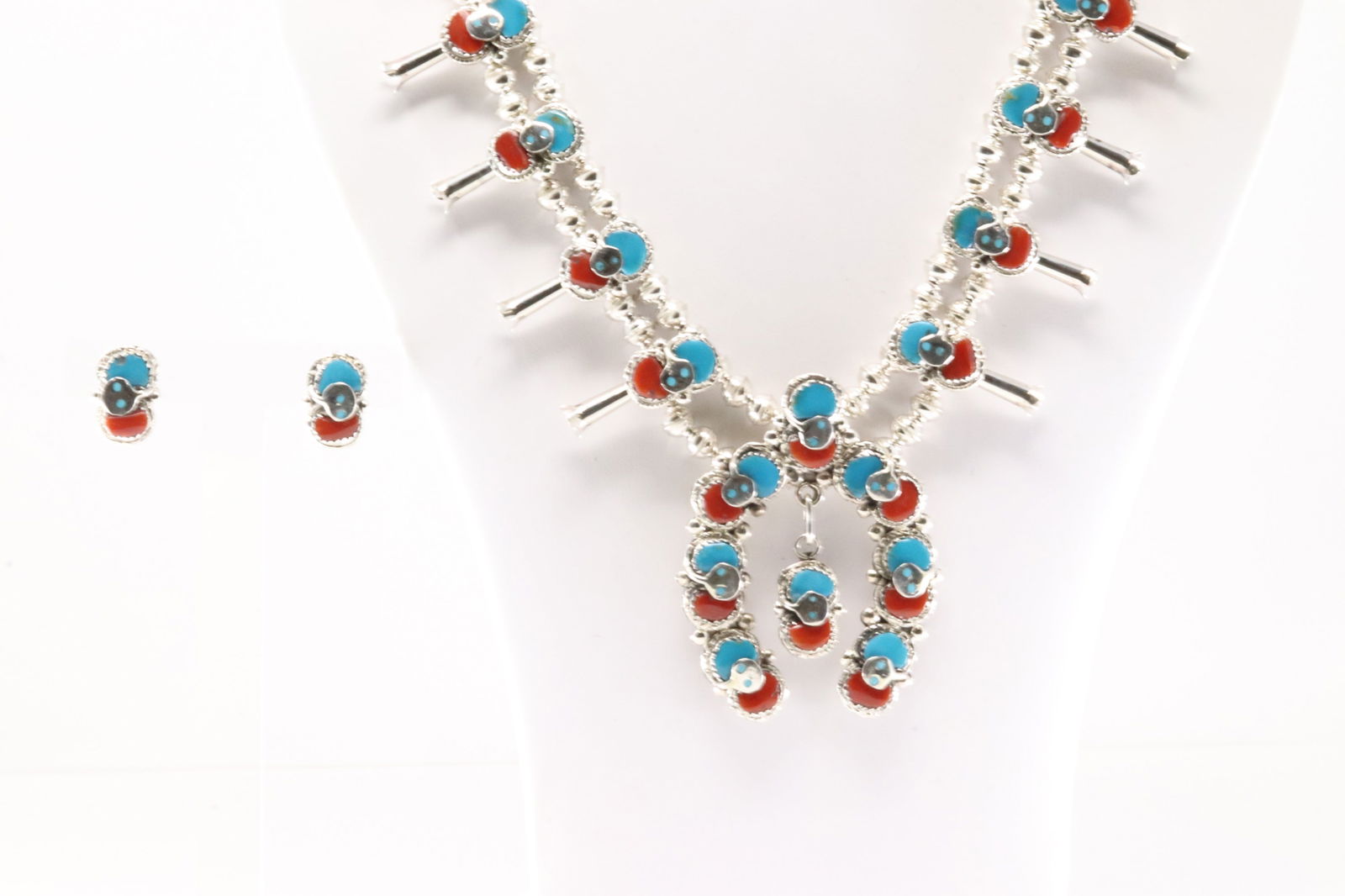 Native America Zuni Sterling Silver Coral & Turquoise Squash Blossom Necklace & Earring's Set By: This is a Native America Zuni Sterling Silver Coral & Turquoise Squash Blossom Necklace & Earring's Set By Effie C. Necklace length: 24.00" Total weight: 99.80 Grams.
