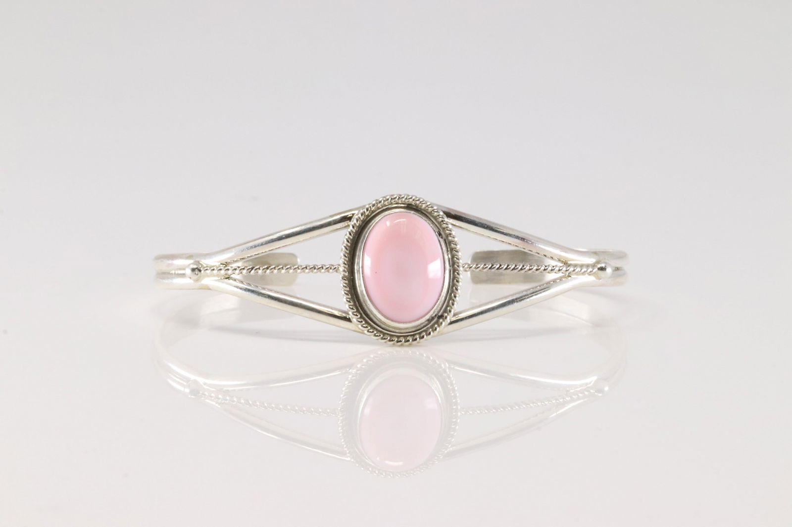 Native America Navajo Sterling Silver Pink Conch Shell Bracelet Cuff By P.Skeets.: This is a Native America Navajo Sterling Silver Pink Conch Shell Bracelet Cuff By P.Skeets.