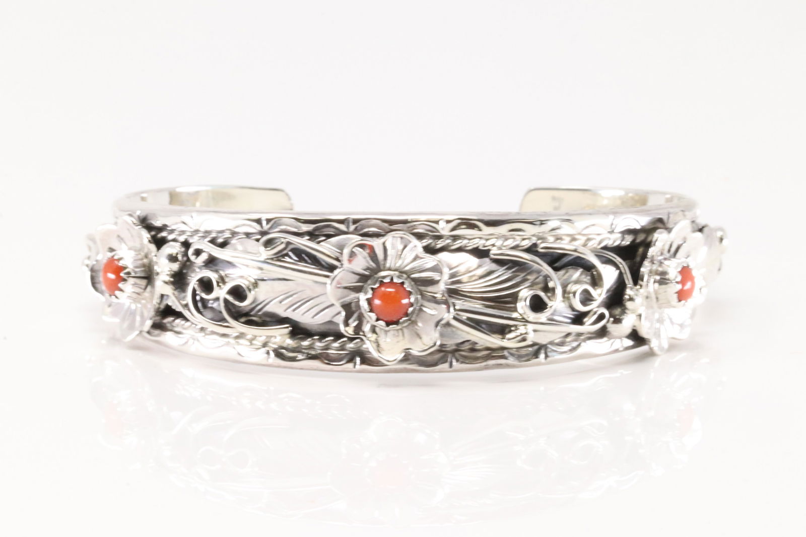 Native America Navajo Sterling Silver Coral Bracelet Floral Cuff By Bessie Joe.: This is a Native America Navajo Sterling Silver Coral Bracelet Floral Cuff By Bessie Joe.