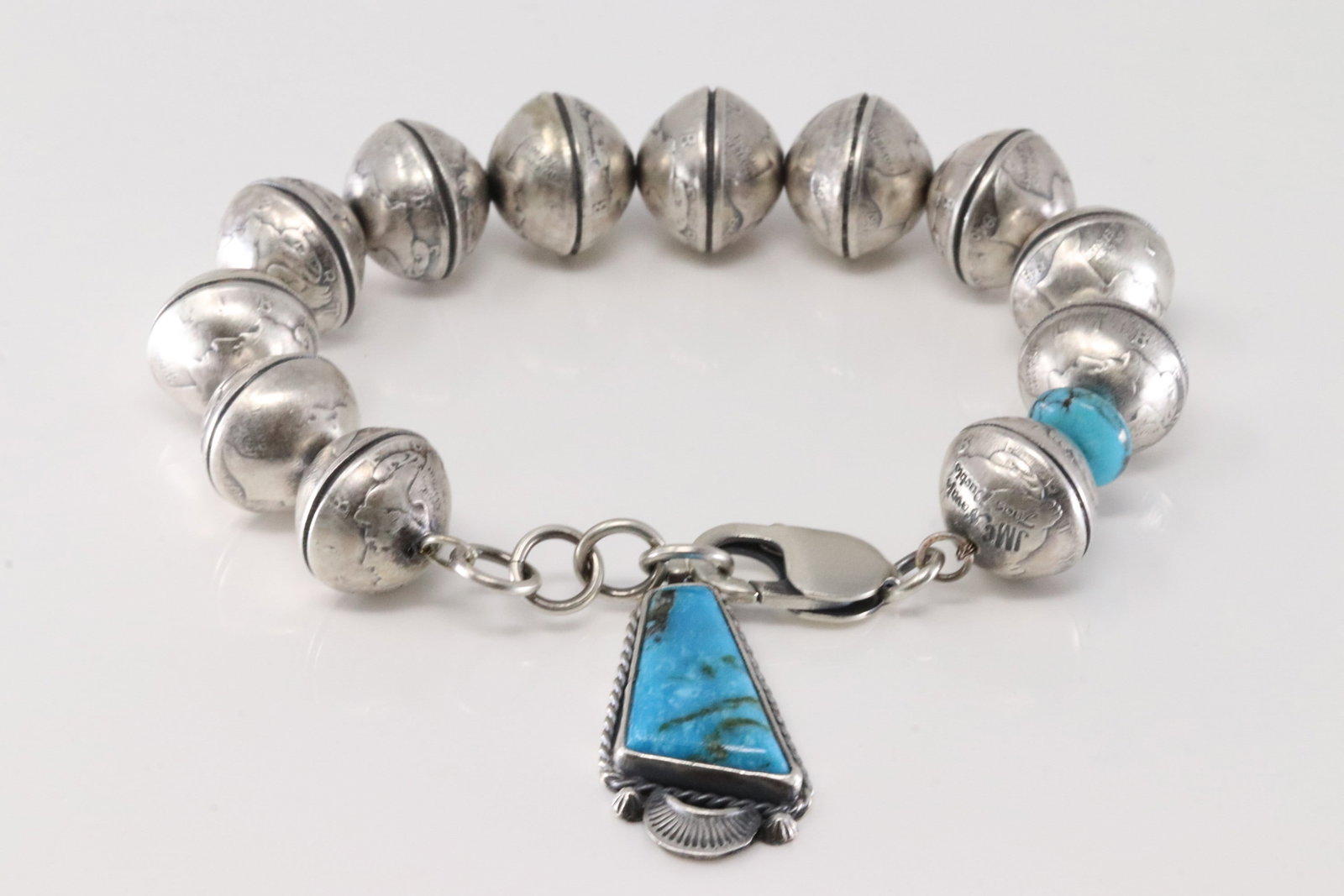 Native America Navajo Sterling Silver Kingman Turquoise Liberty Dime Bracelet Link By James McCabe.: This is a Native America Navajo Sterling Silver Kingman Turquoise Liberty Dime Bracelet Link By James McCabe. Bracelet length: 9.00" Total weight: 68.10 Grams.