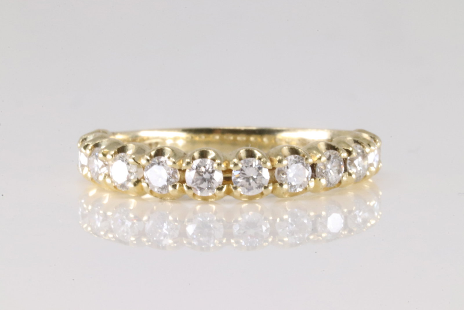 Diamond Ring 14Kt.: Ladies 14Kt Yellow Gold Diamond Ring. This elegant ring has 12 sparkling round diamonds. Diamonds weight approx: 0.75ctw. Ring size: 5.00. Total weight: 2.20 Grams.
